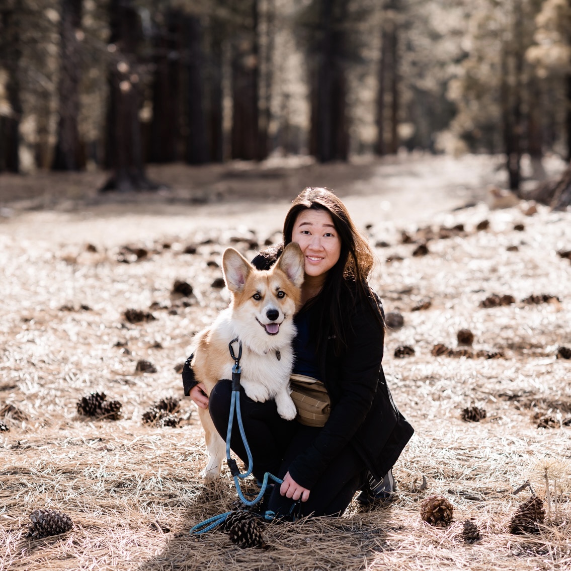 Desiree, an Asian Deaf woman with tan skin and dark brown hair shoulder length, she