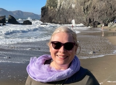 Violeta with ocean and rocks in the background (Location: beach down the Lands End trail in San Francisco).