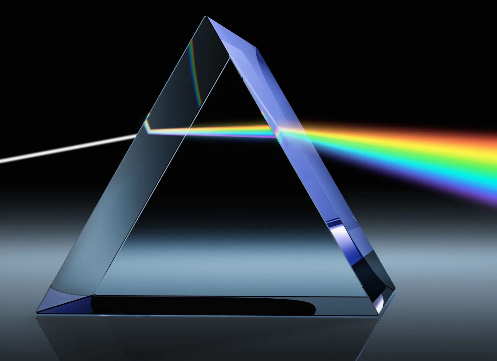 A prism bending white light into a rainbow.