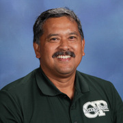 Professor Vallejo in a stylish green polo shirt