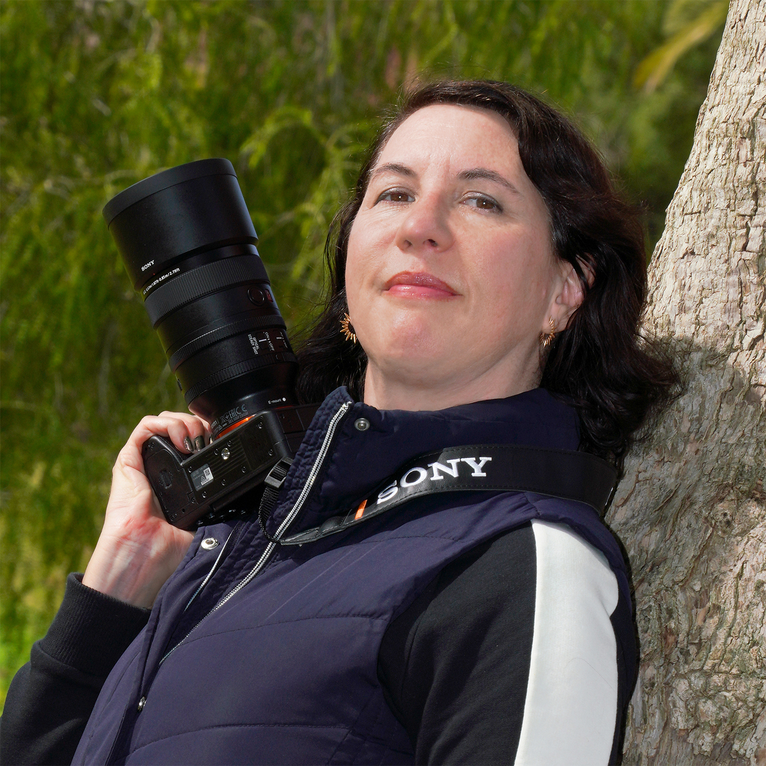 Photograph of Photographer Amy Tierney holding a camera