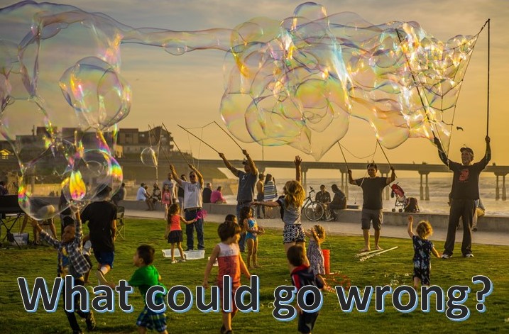Children chasing bubbles