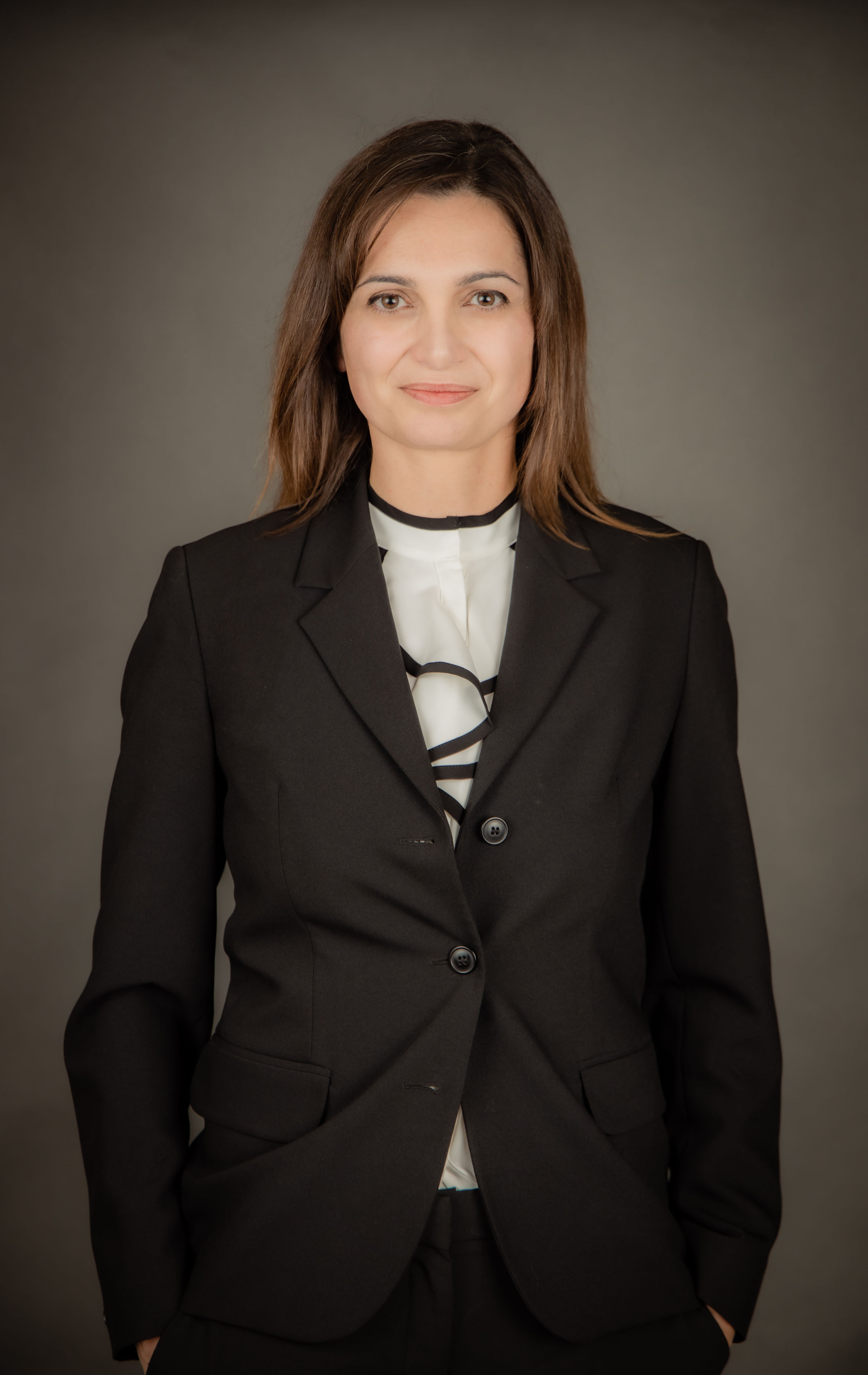 Instructor photo. Brunette in a suit.