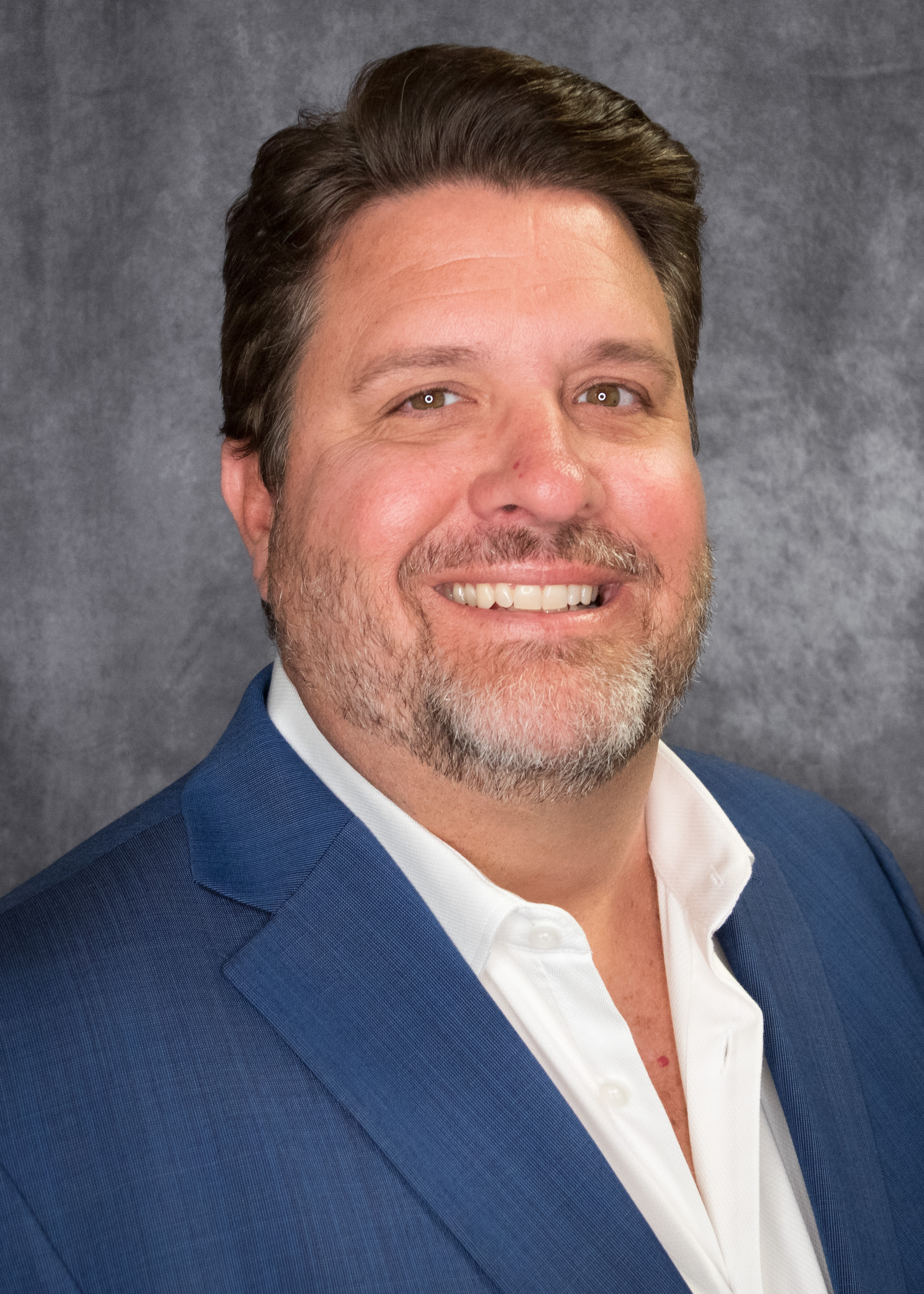 Photo of your Instructor Gary Quire in a blue suit with a white shirt.