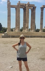 Professor standing in front of a Greek Temple